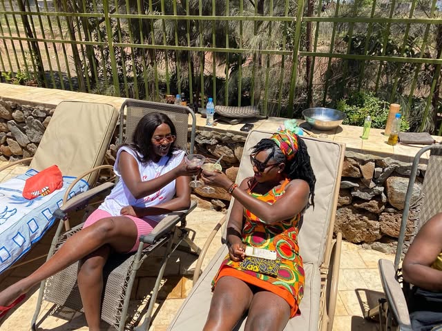 Women gathered outdoors at a Queens Retreat in Arusha